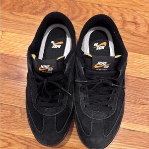 New Balance Men’s Black Suede Sneakers with Yellow Accents